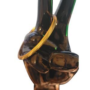 Pretty 6" gold tone bangle with green and white